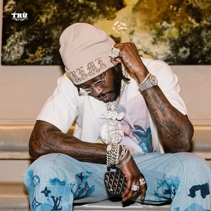 2 Chainz outfit in Louis Vuitton, Supreme, and Goyard, 2021