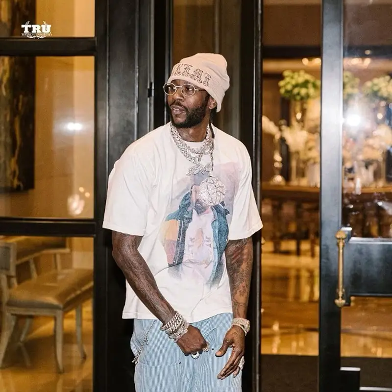 2 Chainz outfit in Louis Vuitton, Supreme, and Goyard, 2021