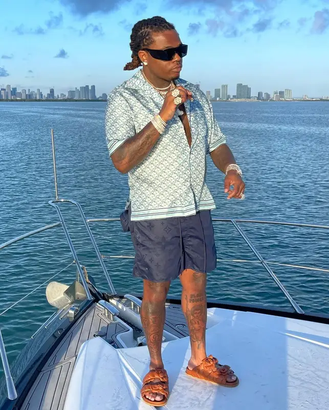 Gunna outfit in Dior, Louis Vuitton, and Versace, 2021