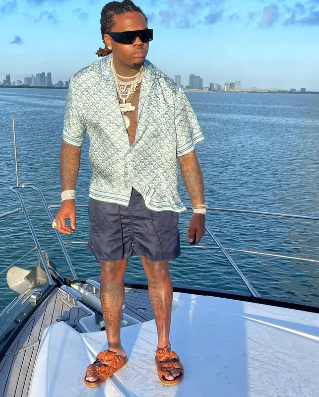 Gunna outfit in Dior, Louis Vuitton, and Versace, 2021
