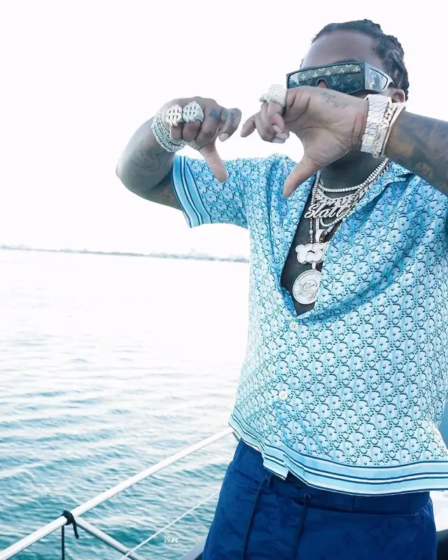 Gunna outfit in Dior, Louis Vuitton, and Versace, 2021
