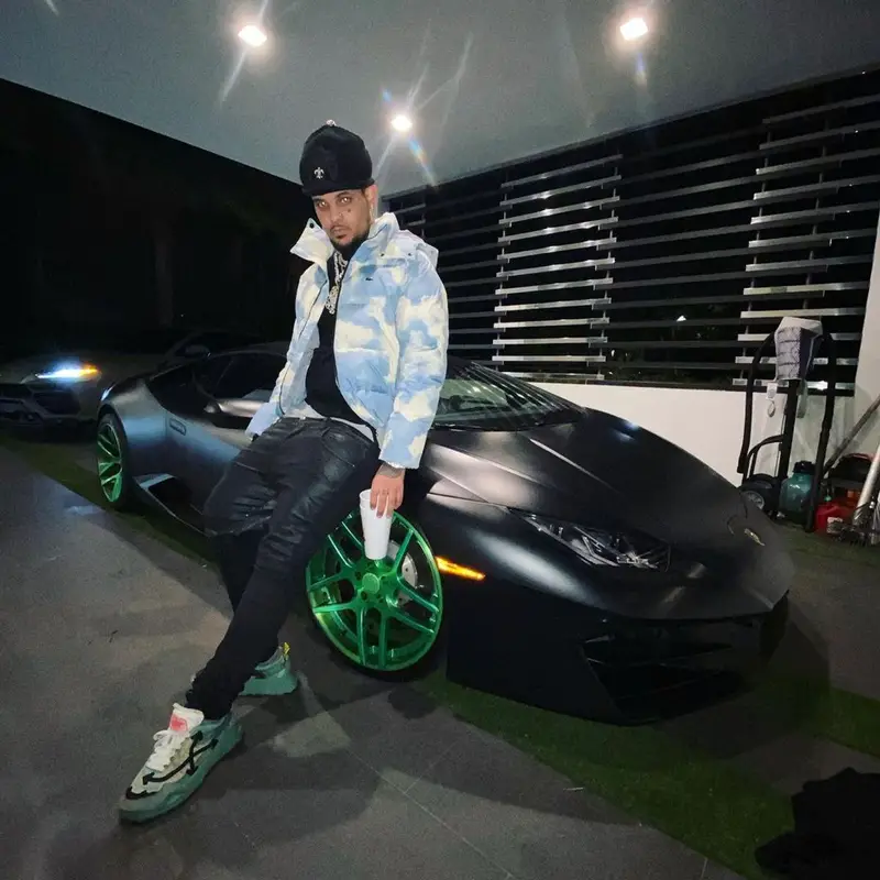 Smokepurpp outfit in Lacoste, Off-White, and Chrome Hearts, 2021