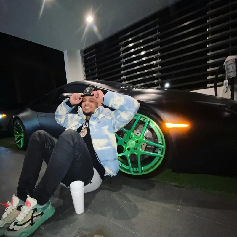 Smokepurpp outfit in Lacoste, Off-White, and Chrome Hearts, 2021
