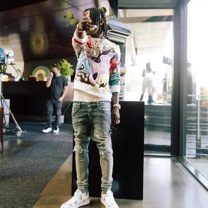Polo G outfit in Dior, Amiri, and Kenny Scharf, 2021