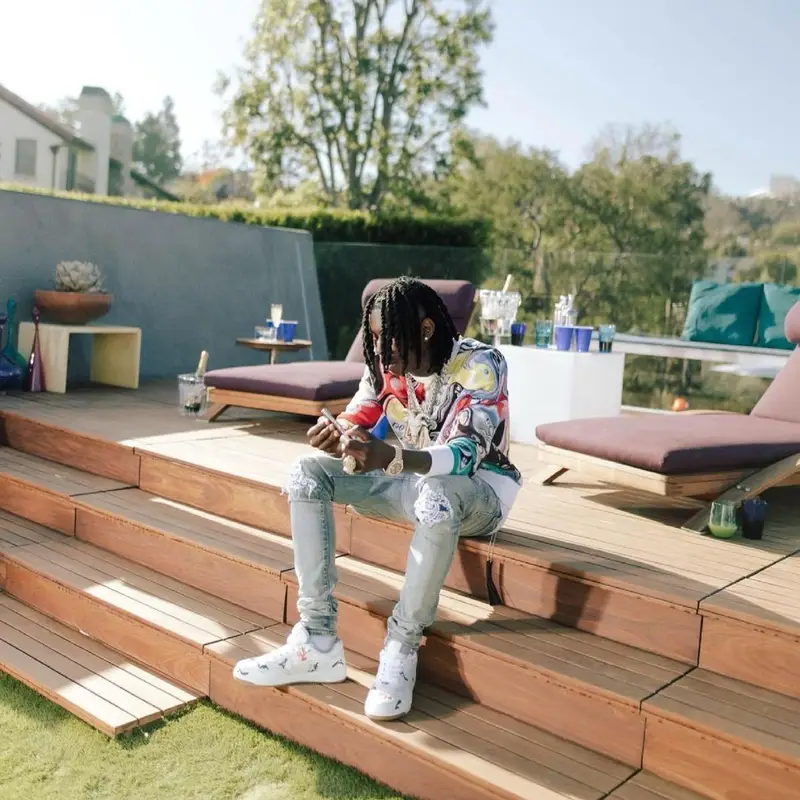 Polo G outfit in Dior, Amiri, and Kenny Scharf, 2021