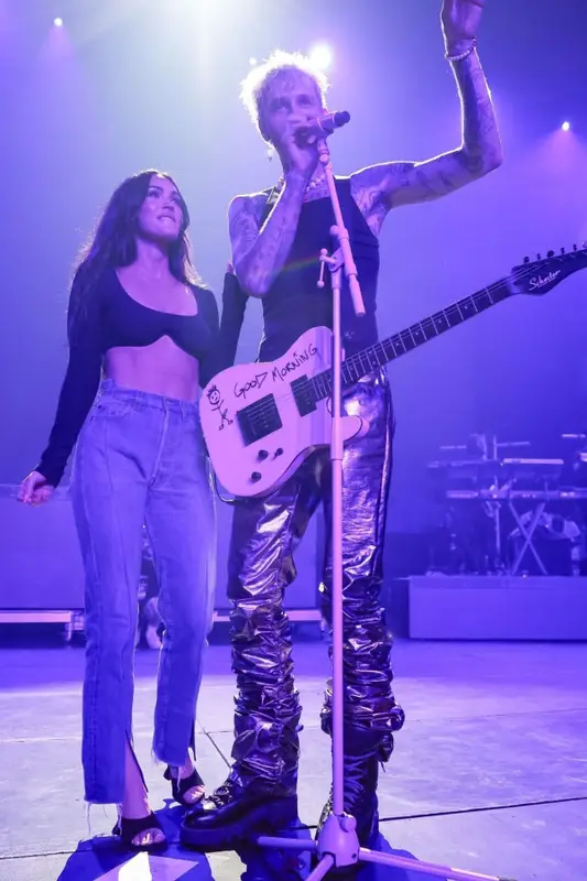Megan Fox outfit in Leslie Amon, EB Denim, and Amina Muaddi, 2021