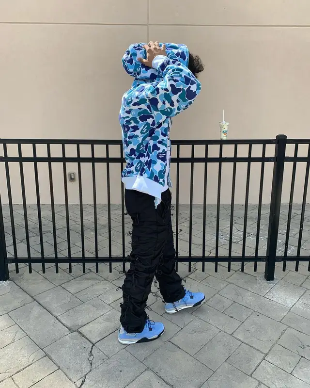 Mikey outfit in Nike, Bape, and Drake Merch, 2021