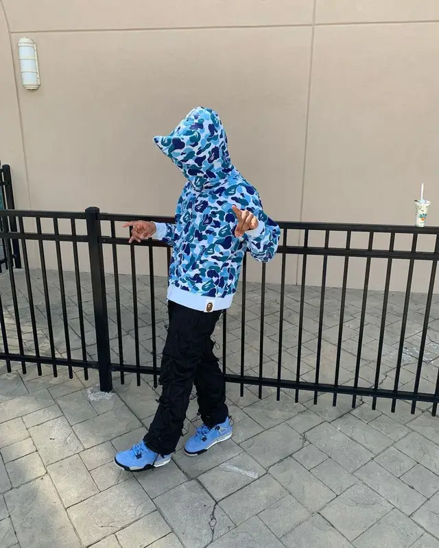 Mikey outfit in Nike, Bape, and Drake Merch, 2021
