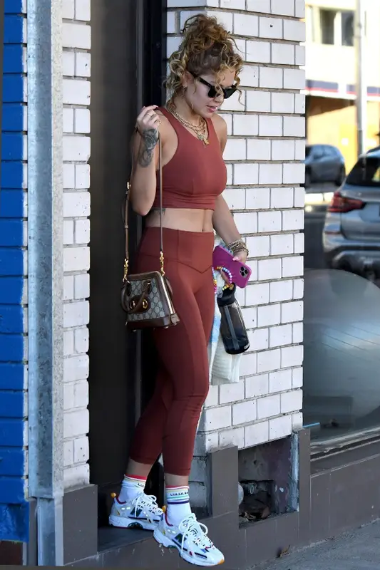 Rita Ora outfit in New Balance, Gucci, and Ray-Ban, 2021