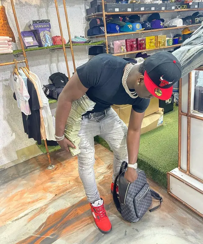 Bankroll Freddie outfit in Polo Ralph Lauren, Louis Vuitton, and New Era, 2021