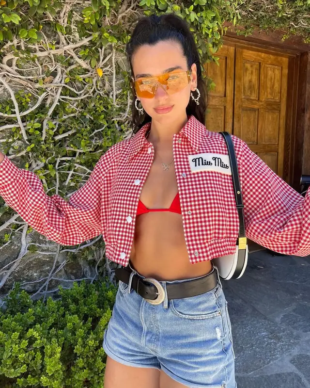 Dua Lipa outfit in Miu Miu, Dsquared2, and Vivienne Westwood, 2021