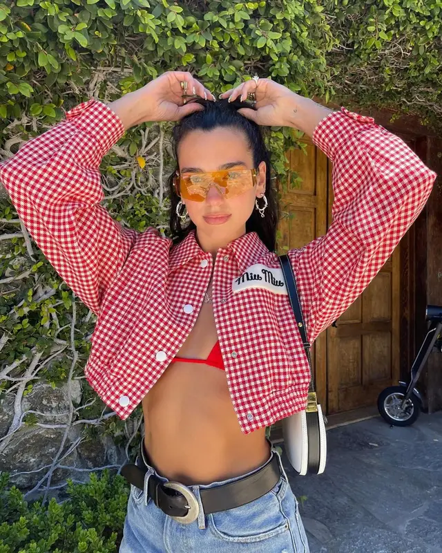 Dua Lipa outfit in Miu Miu, Dsquared2, and Vivienne Westwood, 2021