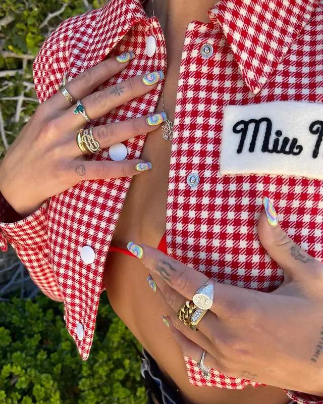Dua Lipa outfit in Miu Miu, Dsquared2, and Vivienne Westwood, 2021