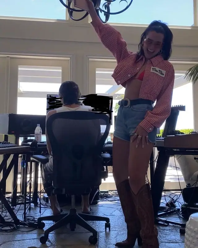 Dua Lipa outfit in Miu Miu, Dsquared2, and Vivienne Westwood, 2021