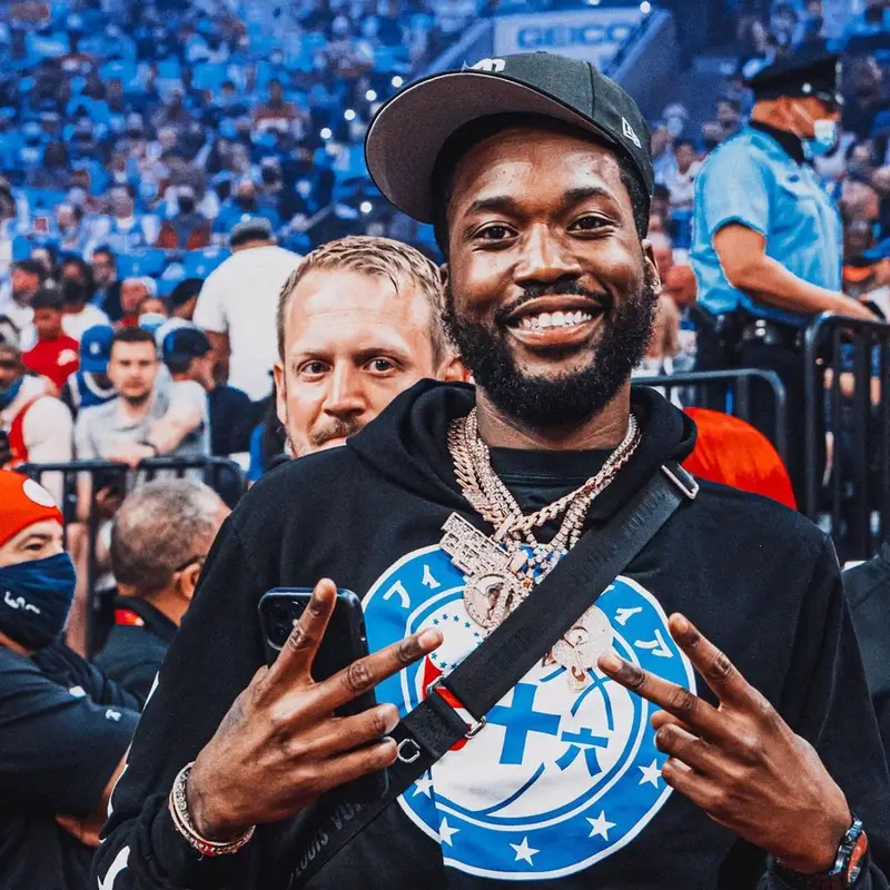Meek Mill outfit in Rhude, Adidas, and New Era, 2021