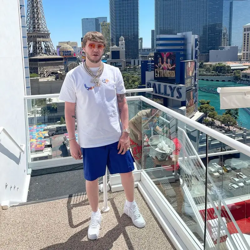 Murda Beatz outfit in Dior, Nike, and Kenny Scharf, 2021