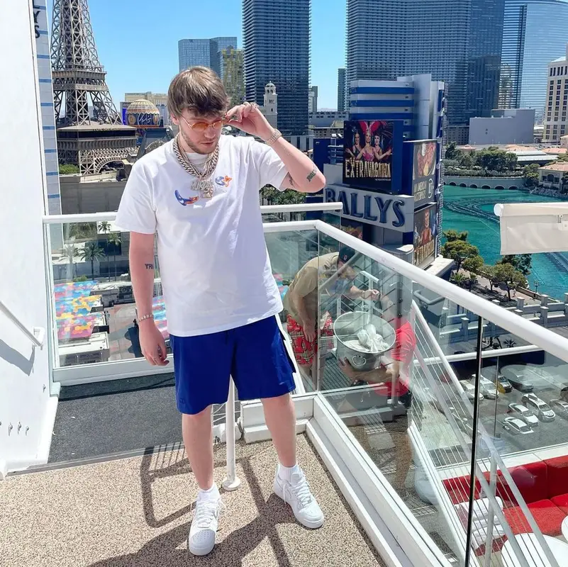 Murda Beatz outfit in Dior, Nike, and Kenny Scharf, 2021