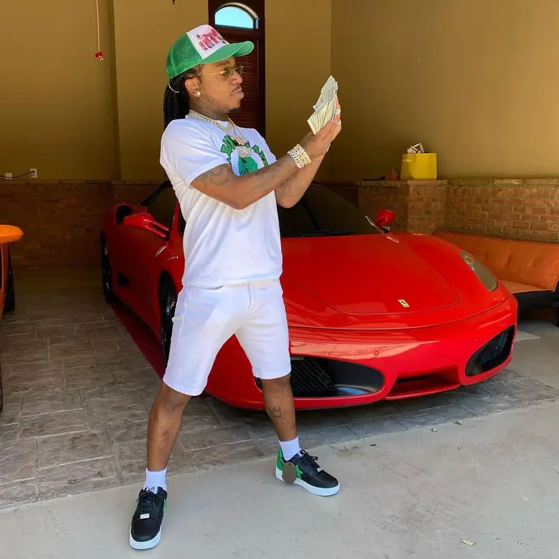 Jacquees outfit in Bape, Cartier, and Gunna Merch, 2021