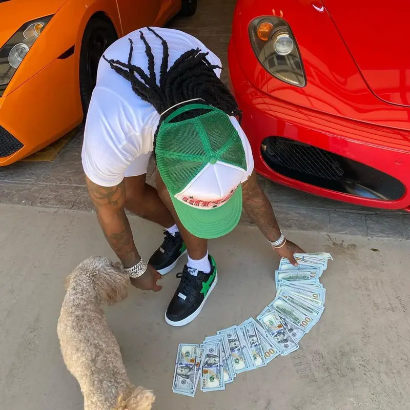 Jacquees outfit in Bape, Cartier, and Gunna Merch, 2021