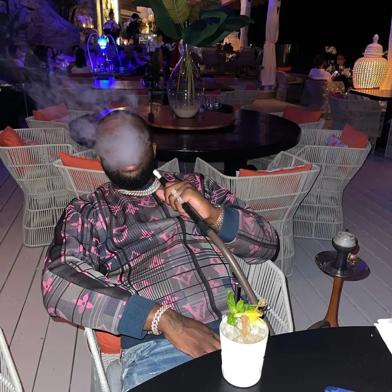 Headie One outfit in Louis Vuitton and Amiri, 2021
