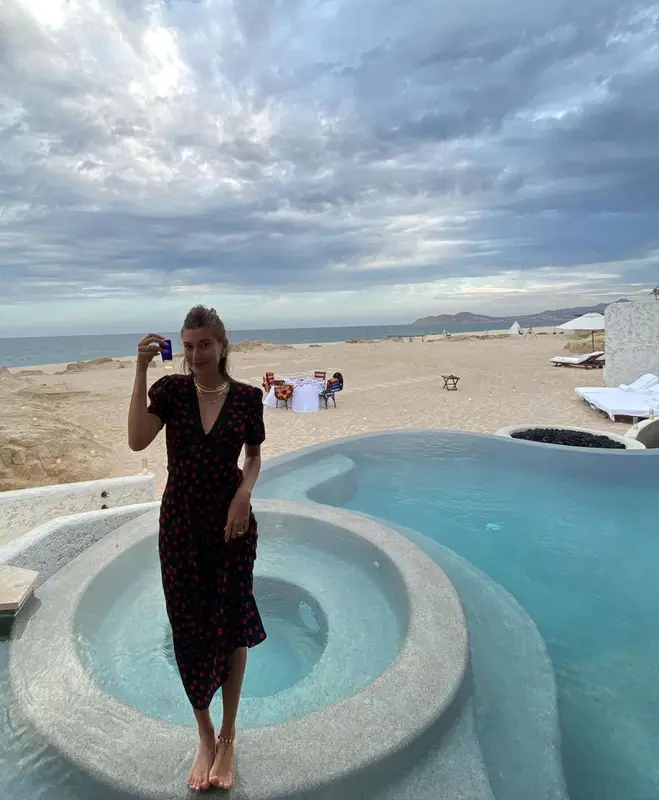 Hailey Bieber outfit in Fallon Jewelry, Anita Ko, and Rixo, 2021