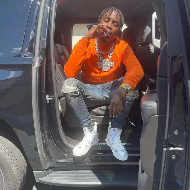 Lil Tjay outfit in Dior, Amiri, and Kenny Scharf, 2021