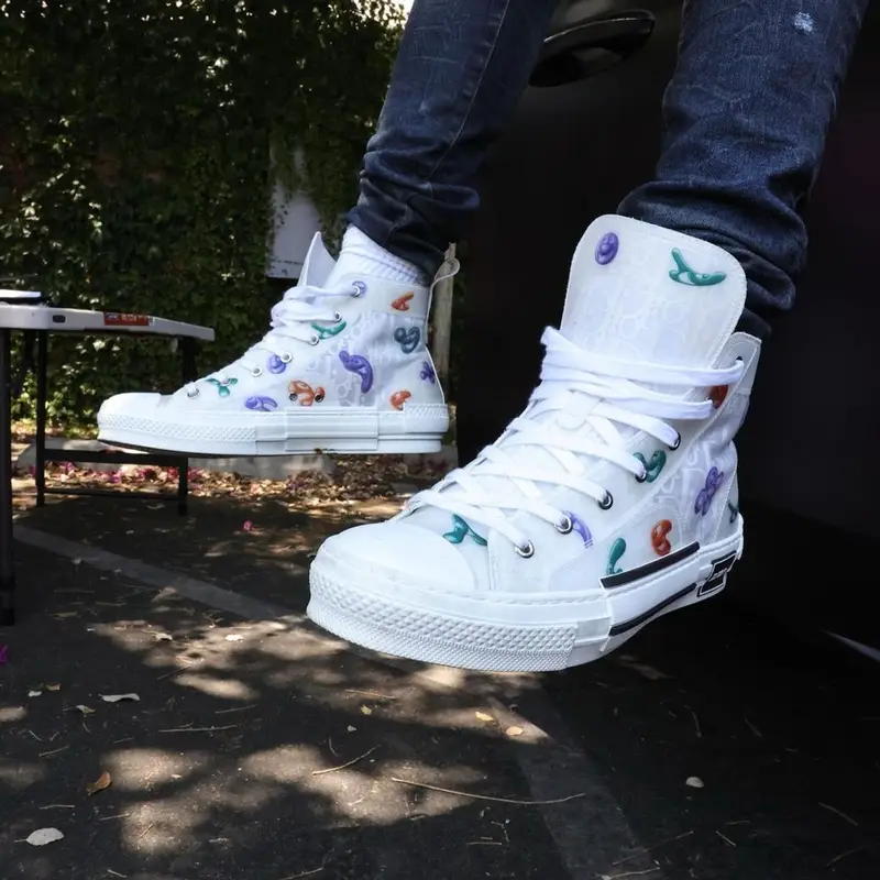 Lil Tjay outfit in Dior, Amiri, and Kenny Scharf, 2021