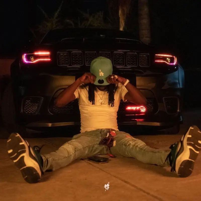 Chief Keef outfit in Polo Ralph Lauren, Amiri, and New Era, 2021