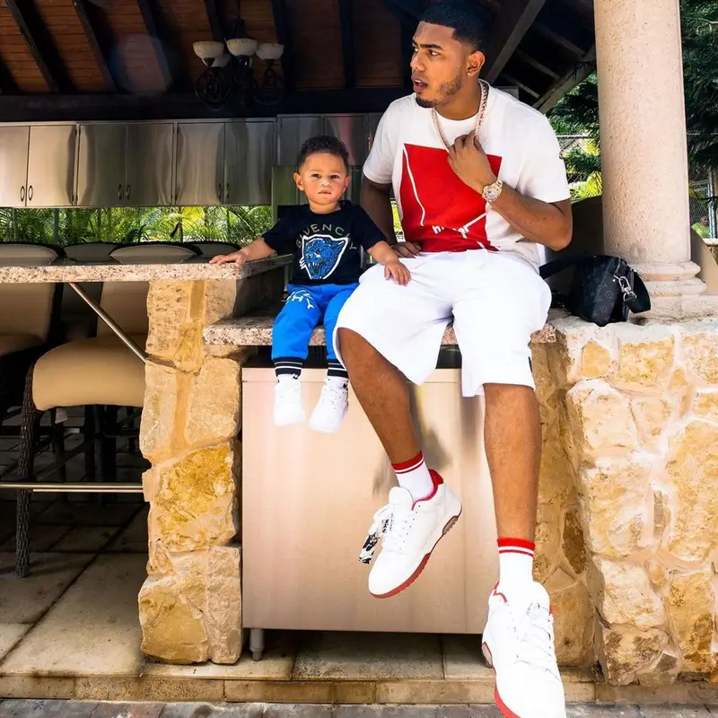 Myke Towers outfit in Moncler, Off-White, and Gucci, 2021