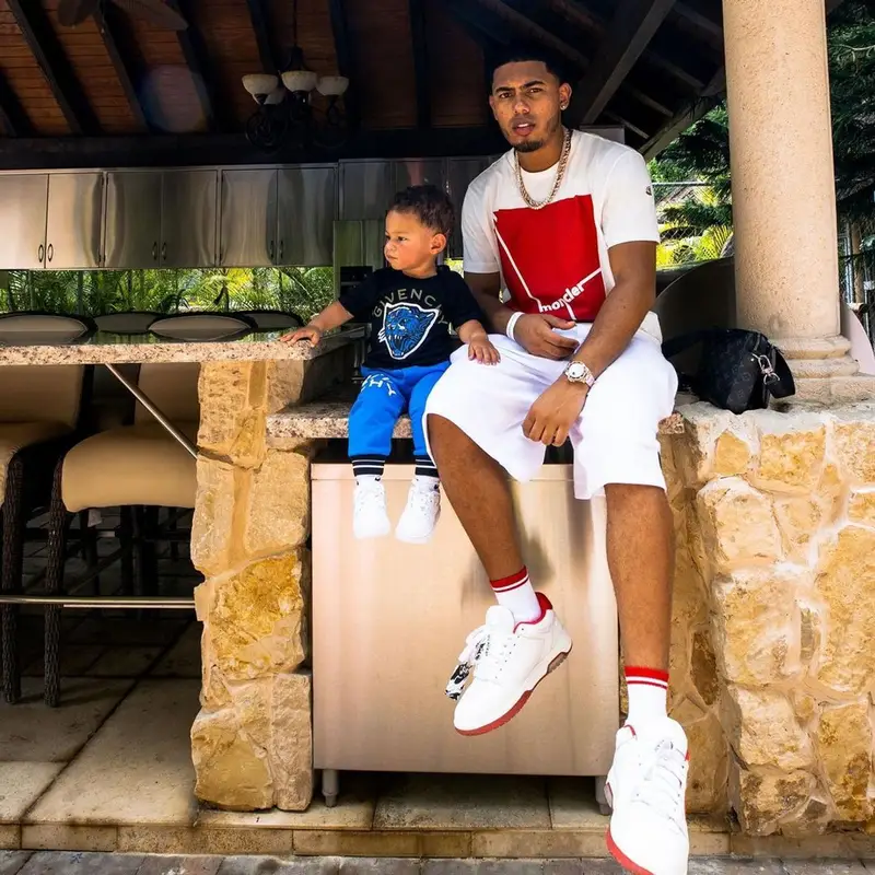Myke Towers outfit in Moncler, Off-White, and Gucci, 2021