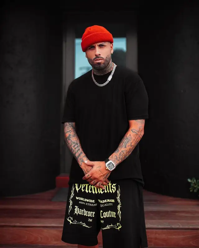 Nicky Jam outfit in Vetements, Jordan, and Nike, 2021