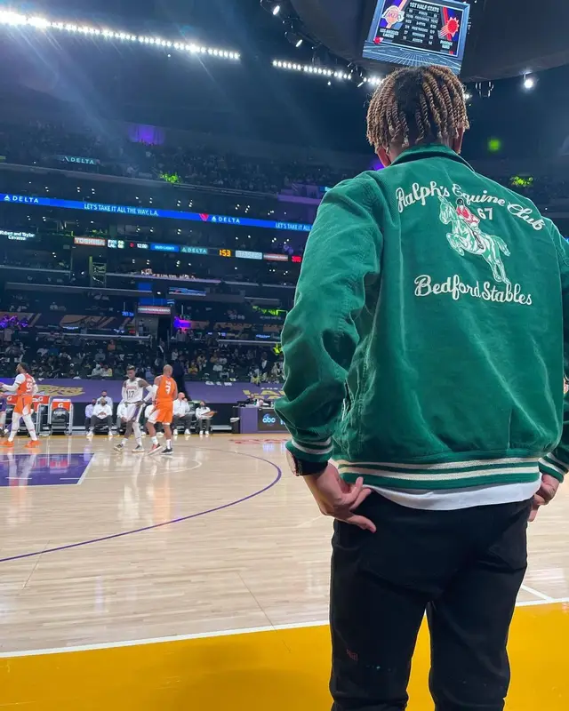 Cordae outfit in Polo Ralph Lauren, Comme Des Garcons, and No Name, 2021