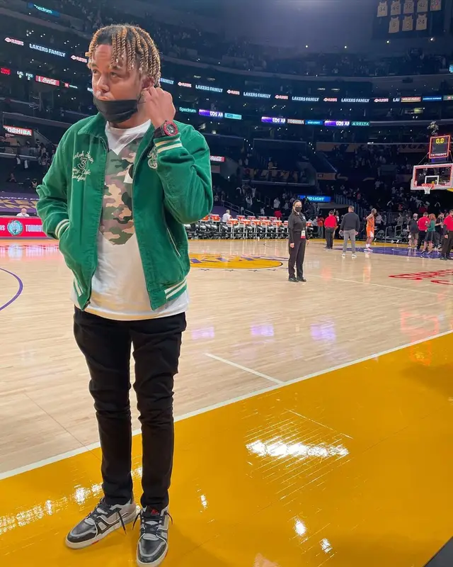 Cordae outfit in Polo Ralph Lauren, Comme Des Garcons, and No Name, 2021