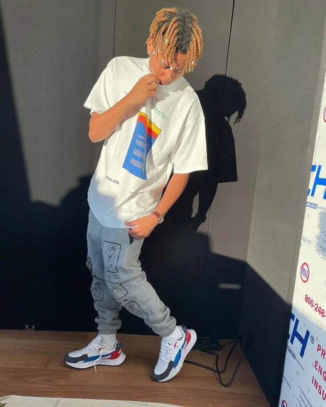 Cordae outfit in Pyer Moss, Hypland, and Puma, 2021