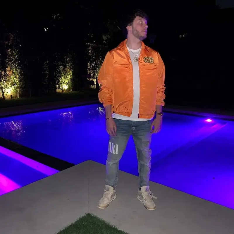 Murda Beatz outfit in Dior, Amiri, and Jordan, 2021