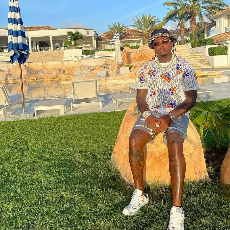 Gunna outfit in Kenny Scharf, Jean Paul Gaultier, and Dior, 2021