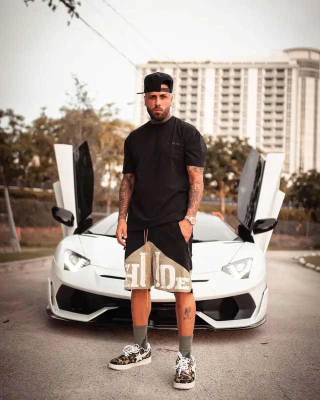 Nicky Jam outfit in Undergold, Rhude, and Bape, 2021