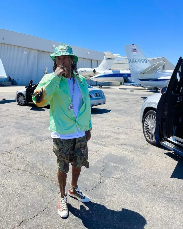 Tyga outfit in Martine Rose, Converse, and Kapital, 2021