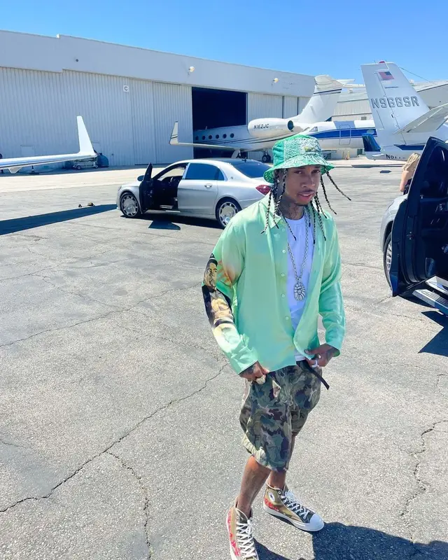 Tyga outfit in Martine Rose, Converse, and Kapital, 2021