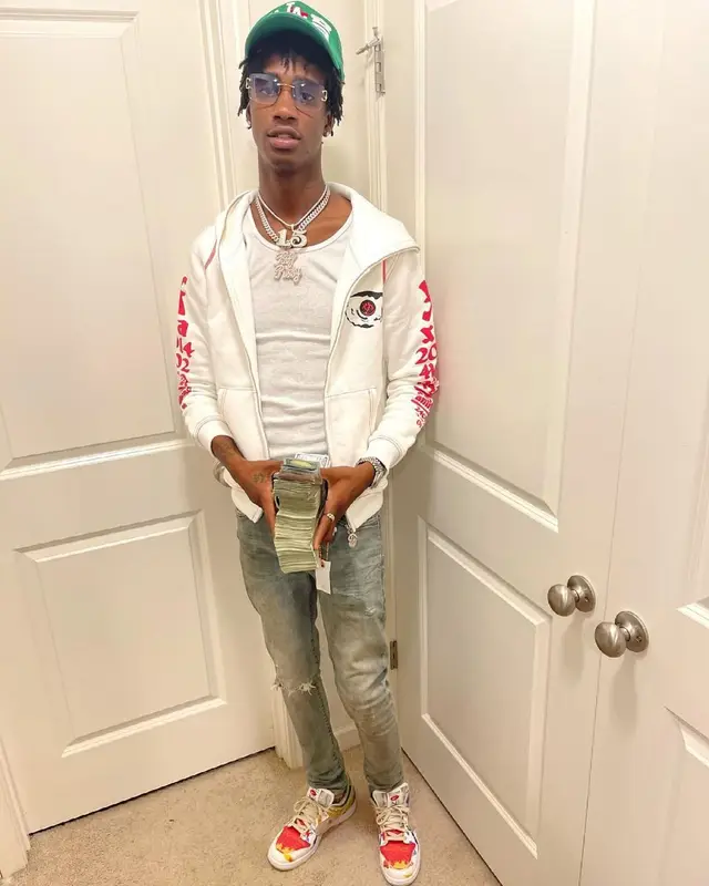 Yung Mal outfit in Purple Brand, Gucci, and Cartier, 2021