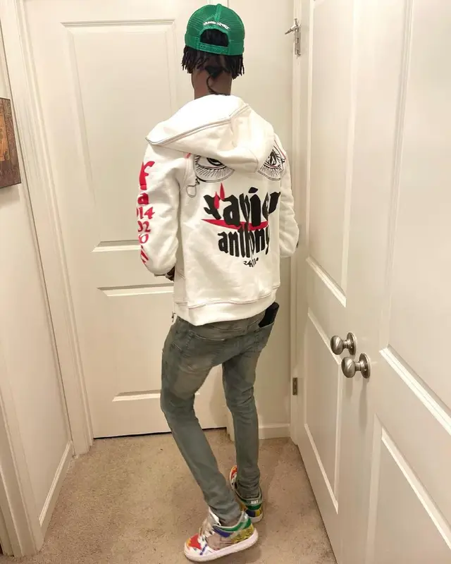 Yung Mal outfit in Purple Brand, Gucci, and Cartier, 2021