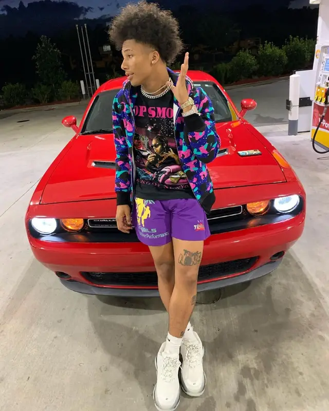 Mikey outfit in Vlone, Bape, and Pop Smoke Merch, 2021