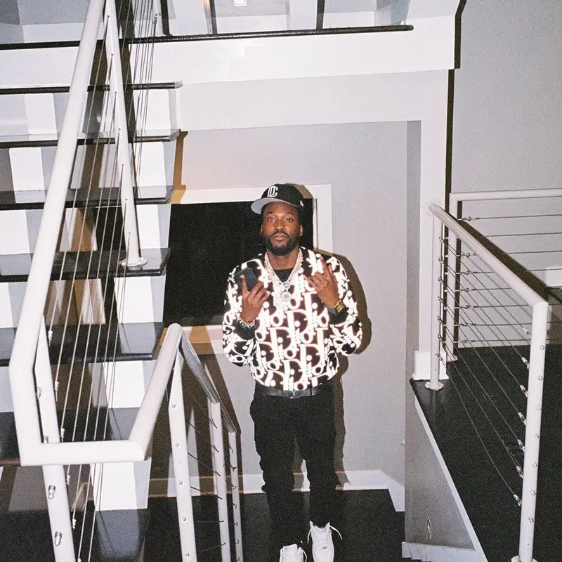 Meek Mill outfit in Dior, Louis Vuitton, and New Era, 2021