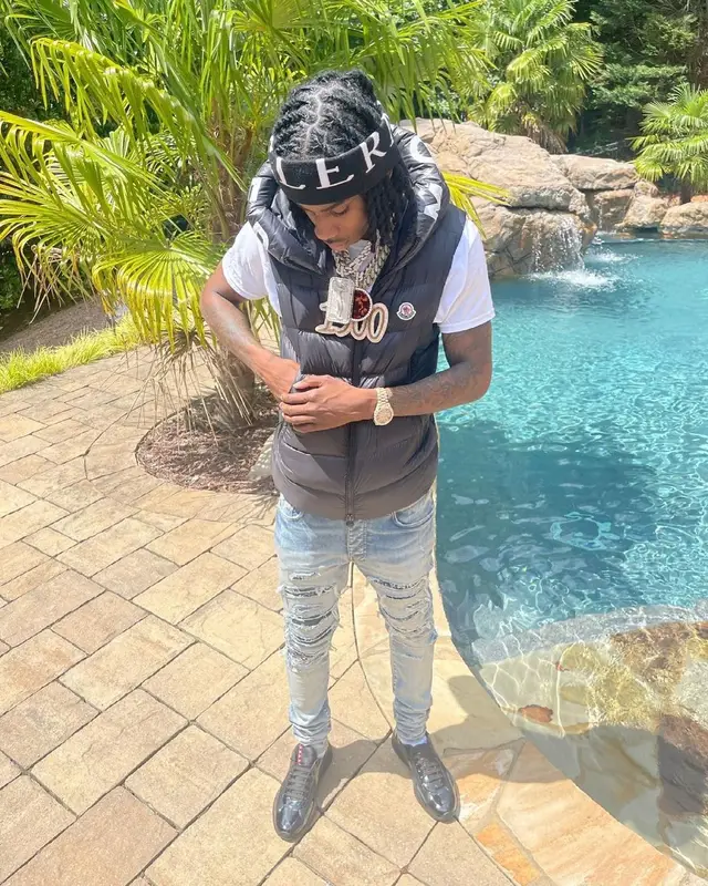 Polo G outfit in Amiri, Prada, and Moncler, 2021