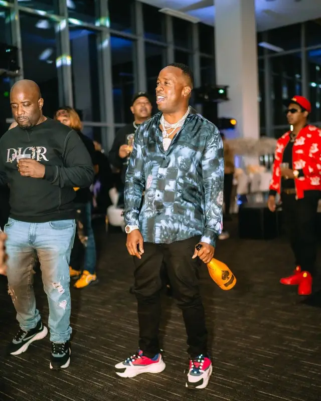 Yo Gotti outfit in Louis Vuitton, Amiri, and Dior, 2021