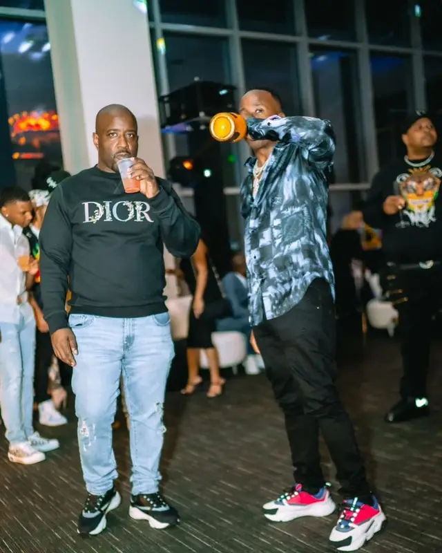 Yo Gotti outfit in Louis Vuitton, Amiri, and Dior, 2021