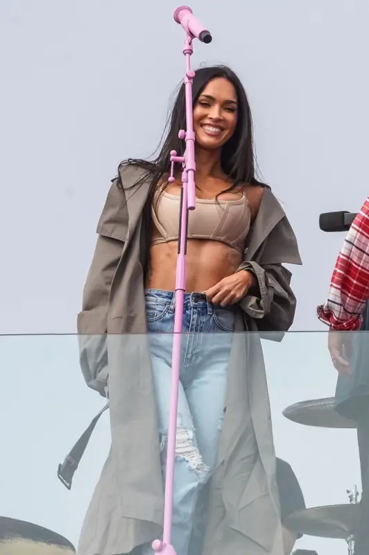 Megan Fox outfit in Acne Studios, Ksubi, and Amina Muaddi, 2021