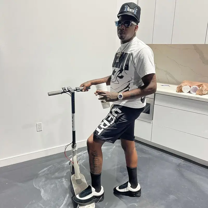 Lil Duke outfit in Vertabrae, Raf Simons, and Dior, 2021