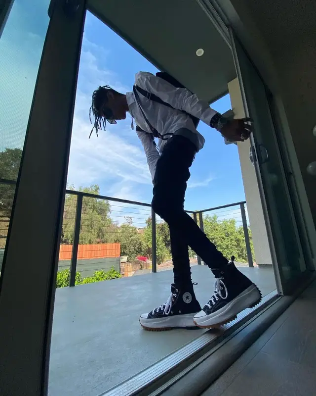 TheHxliday outfit in Saint Laurent, Converse, and Louis Vuitton, 2021