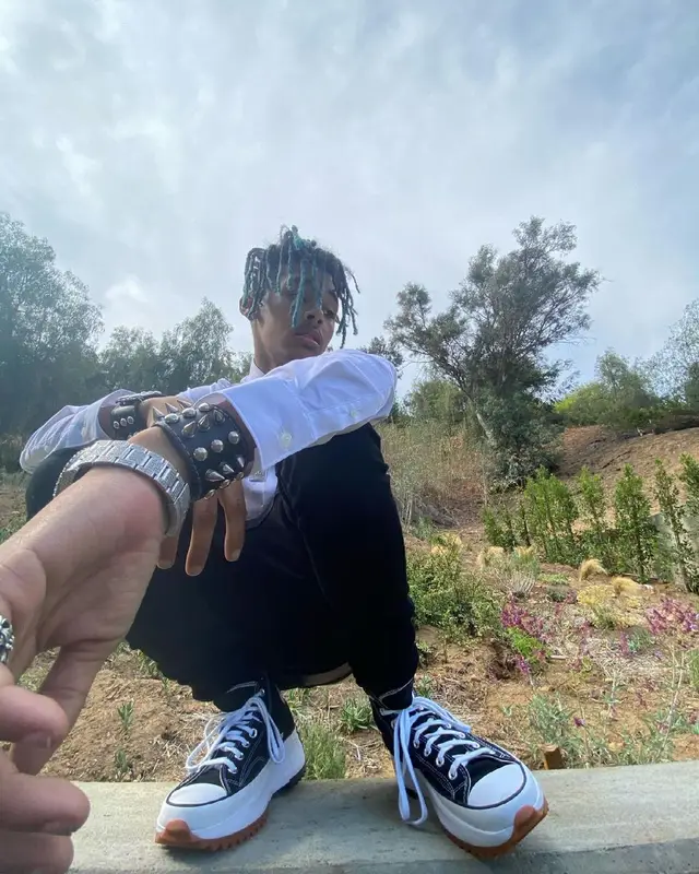TheHxliday outfit in Saint Laurent, Converse, and Louis Vuitton, 2021